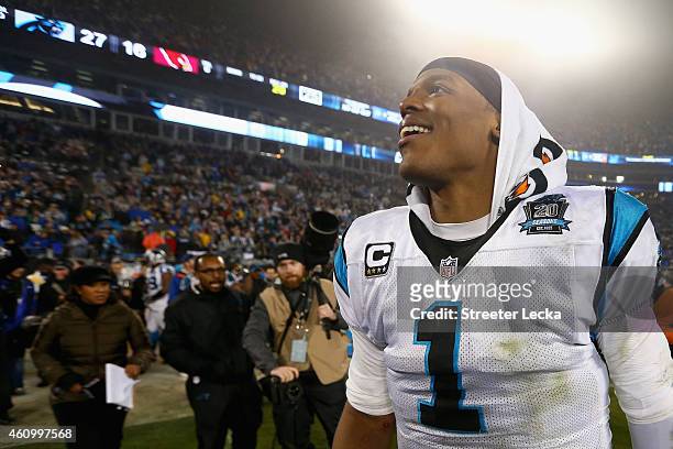 Cam Newton of the Carolina Panthers reacts after winning 27-16 against the Arizona Cardinals after their NFC Wild Card Playoff game at Bank of...