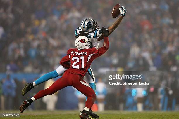 Patrick Peterson of the Arizona Cardinals defends a pass to Kelvin Benjamin of the Carolina Panthers in the 4th quarter during their NFC Wild Card...