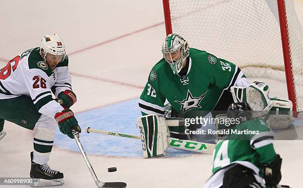 Kari Lehtonen of the Dallas Stars makes a save in front of Thomas Vanek of the Minnesota Wild in the first period at American Airlines Center on...