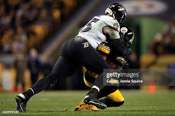 Terrell Suggs of the Baltimore Ravens tackles Dri Archer of the Pittsburgh Steelers during their AFC Wild Card game at Heinz Field on January 3, 2015...