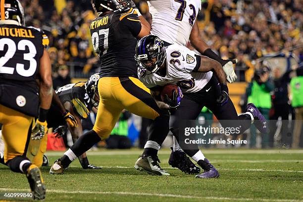 Bernard Pierce of the Baltimore Ravens scores a touchdown in the second quarter against the Pittsburgh Steelers during their AFC Wild Card game at...