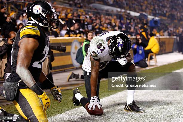 Torrey Smith of the Baltimore Ravens celebrates a third quarter touchdown against the Pittsburgh Steelers during their AFC Wild Card game at Heinz...