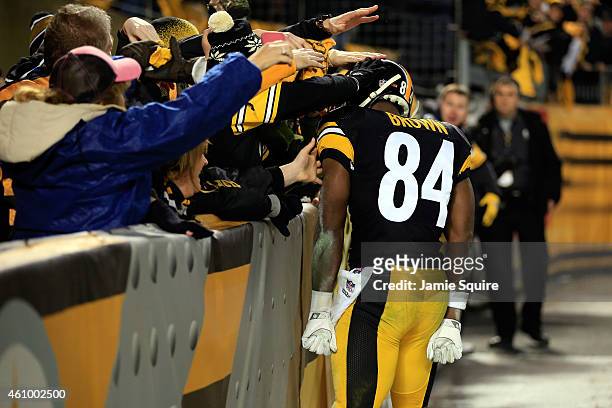 Antonio Brown of the Pittsburgh Steelers celebrates with fans against the Baltimore Ravens during their AFC Wild Card game at Heinz Field on January...