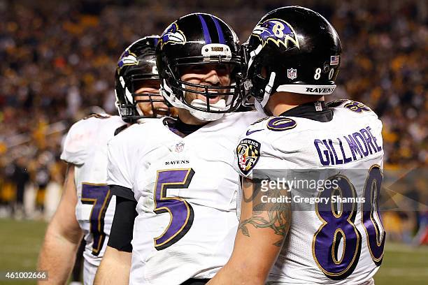 Crockett Gillmore celebrates a fourth quarter touchdown with Joe Flacco of the Baltimore Ravens against the Pittsburgh Steelers during their AFC Wild...