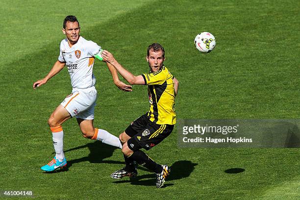 Jeremy Brockie of the Phoenix controls the ball under pressure from Jade North of the Roar during the round 15 A-League match between the Wellington...