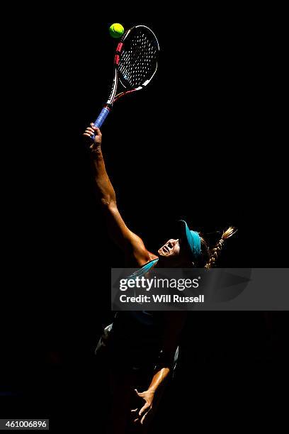 Eugenie Bouchard of Canada serves in the mixed doubles match against Adam Pavlasek and Lucie Safarova of the Czech Republic during day one of the...