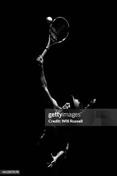 Eugenie Bouchard of Canada serves in the mixed doubles match against Adam Pavlasek and Lucie Safarova of the Czech Republic during day one of the...