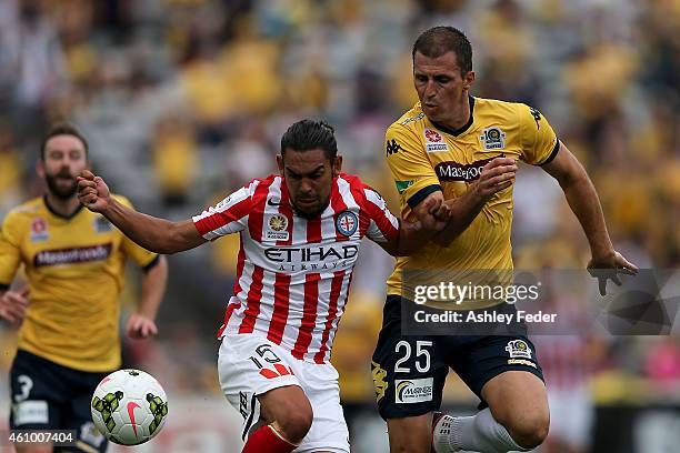 Eddy Bosnar of the Mariners contests the ball against David Williams of Melbourne City during the round 15 A-League match between the Central Coast...