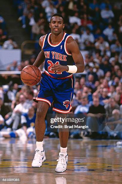 Charlie Ward of the New York Knicks dribbles the ball during a game played circa 1996 at Oakland-Alameda County Coliseum in Oakland, California. NOTE...
