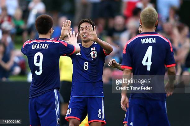 Hiroshi Kiyotake and Shinji Okazaki of Japan celebrate a goal during the Asian Cup practice match between Japan and Auckland City on January 4, 2015...