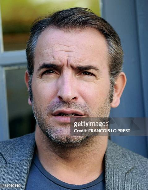 French actor Jean Dujardin poses on September 27, 2011 at the Hotel Gantois in Lille, northern France after a press conference to present French...
