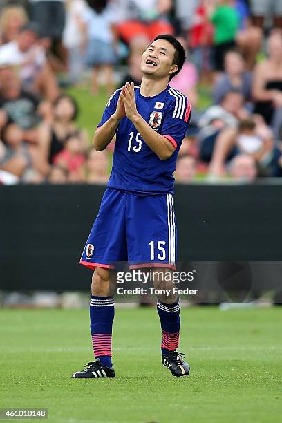 Yasuyuki Konno of Japan reacts after missing a shot at goal during the Asian Cup practice match between Japan and Auckland City on January 4, 2015 in...