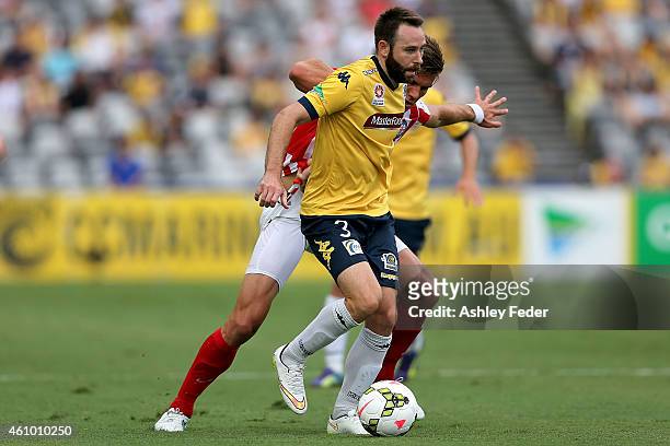 Joshua Rose of the Mariners contests the ball against Erik Paartalu of Melbourne City during the round 15 A-League match between the Central Coast...