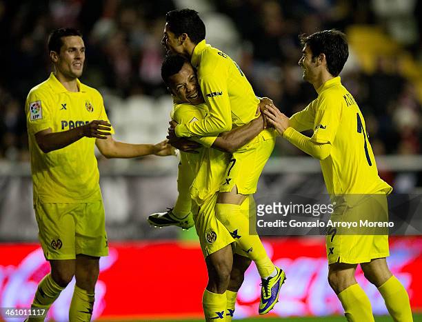 Ikechukwu Uche of Villarreal CF celebrates scoring their fourth goal with teammates Jeremy Louis Perbet , Javier Ignacio Aquino and Manuel Trigueros...