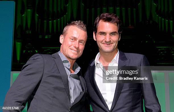 Roger Federer and Lleyton Hewitt pose for a photo after speaking at the A Summer Night with the Stars of International Tennis at the Brisbane Town...