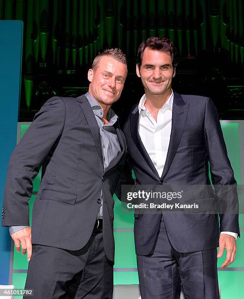 Roger Federer and Lleyton Hewitt pose for a photo after speaking at the A Summer Night with the Stars of International Tennis at the Brisbane Town...