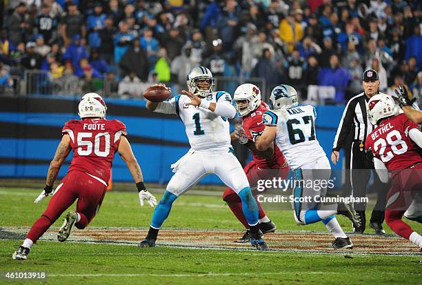 Cam Newton of the Carolina Panthers passes against the Arizona Cardinals during the NFC Wild Card Playoff game on January 3, 2015 at Bank of America...