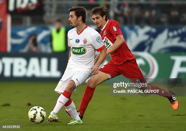 Monaco's Bernardo vies with Nîmes's Algerian defender Fethi Harek during the French Cup football match Nîmes vs Monaco, on January 04, 2015 at the...