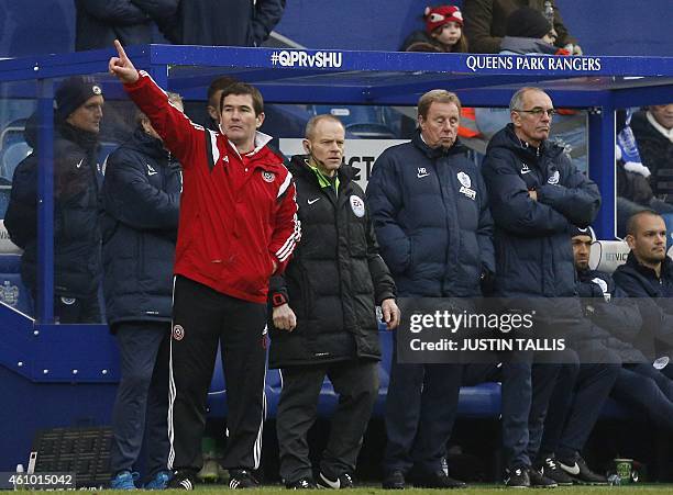 Sheffield United's English manager Nigel Clough gestures near to Queens Park Rangers' English manager Harry Redknapp during the English FA Cup third...