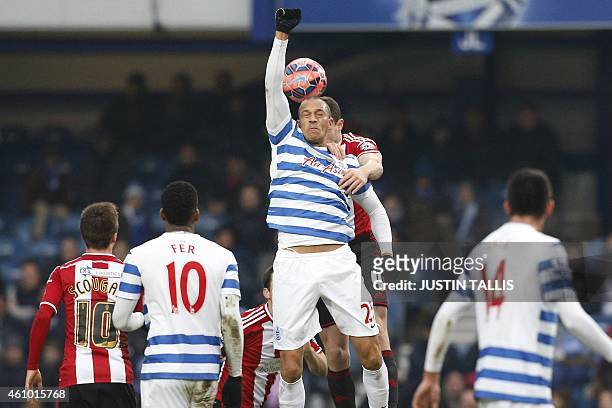 Queens Park Rangers' English striker Bobby Zamora goes up for a header during the English FA Cup third round football match between Queens Park...