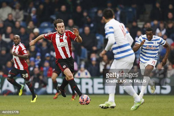 Sheffield United's English midfielder Jose Baxter runs with the ball during the English FA Cup third round football match between Queens Park Rangers...