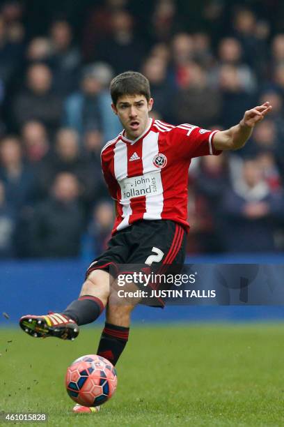 Sheffield United's Scottish midfielder Ryan Flynn passes the ball during the English FA Cup third round football match between Queens Park Rangers...