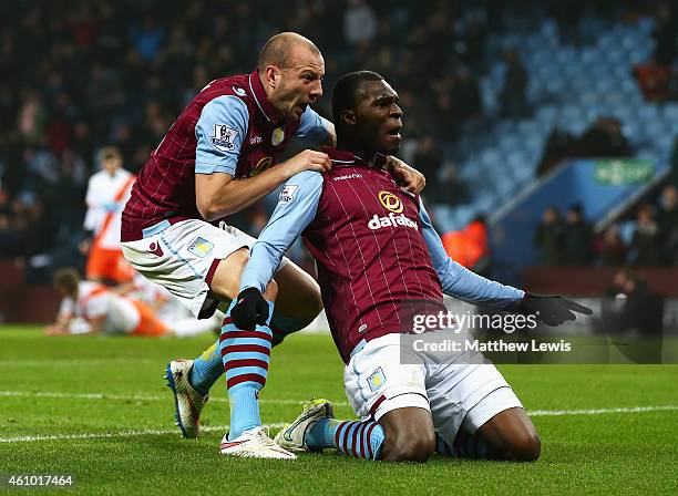 Christian Benteke of Aston Villa celebrates scoring the opening goal with Alan Hutton during the FA Cup Third Round match between Aston Villa and...