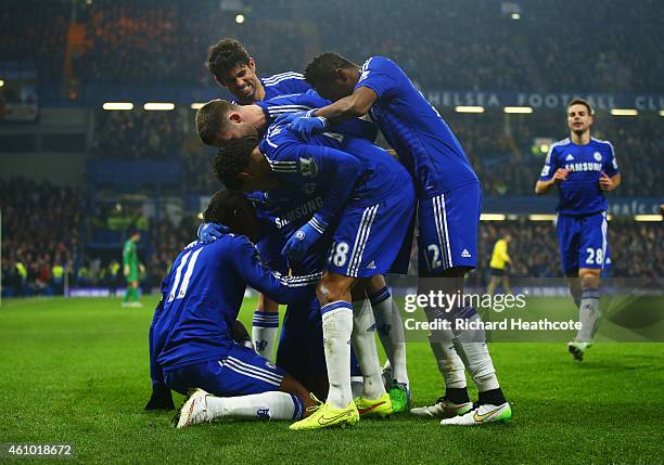 Kurt Zouma of Chelsea celebrates with team mates as he scores their third goal during the FA Cup Third Round match between Chelsea and Watford at...