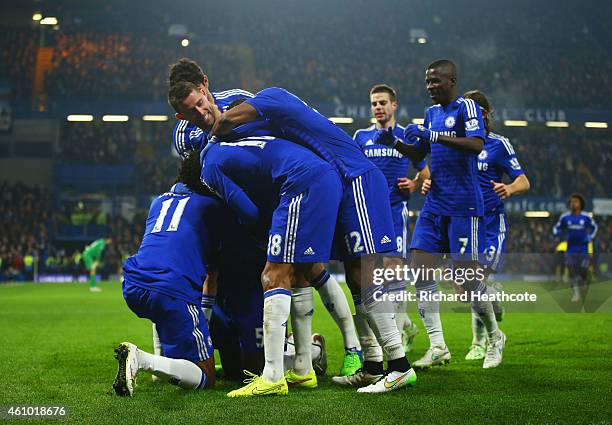 Kurt Zouma of Chelsea celebrates with team mates as he scores their third goal during the FA Cup Third Round match between Chelsea and Watford at...