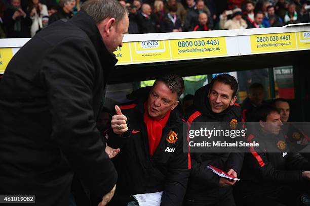 Gary Johnson the manager of Yeovil Town greets Lois Van Gaal the manager of Manchester United prior to kick off during the FA Cup Third Round match...