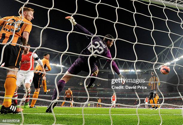 Per Mertesacker heads a goal for Arsenal past Steve Harper of Hull during the match between Arsenal and Hull City in the FA Cup 3rd Round at Emirates...