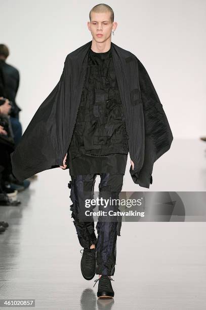 Model walks the runway at the Matthew Miller Autumn Winter 2014 fashion show during London Menswear Fashion Week on January 6, 2014 in London, United...