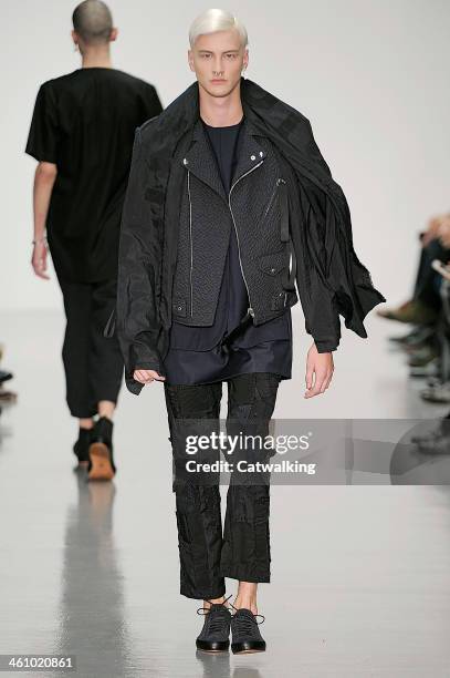 Model walks the runway at the Matthew Miller Autumn Winter 2014 fashion show during London Menswear Fashion Week on January 6, 2014 in London, United...