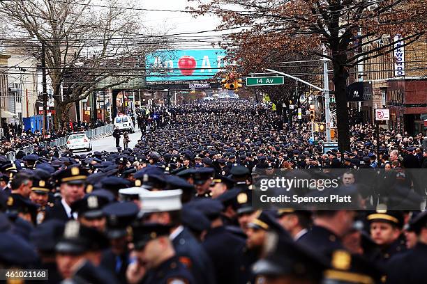 Police officers from across the country attend a funeral service for slain New York City Police Officer Wenjian Liu January 4, 2015 in New York City....