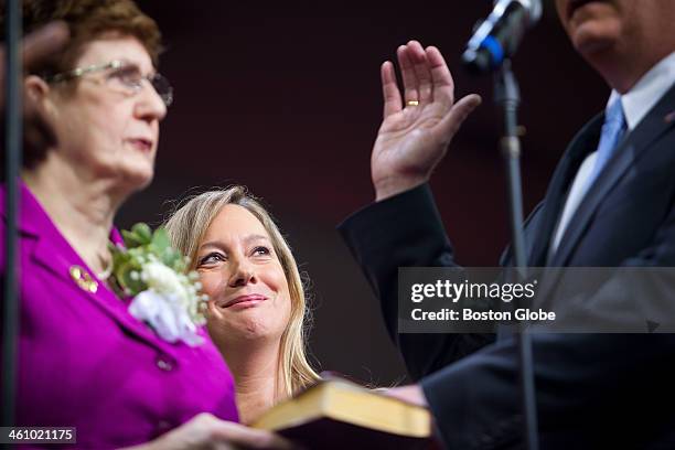 Lorrie Higgins, longtime girlfriend of Marty Walsh, watches as Walsh was sworn in as mayor of Boston during an inauguration ceremony at the Conte...