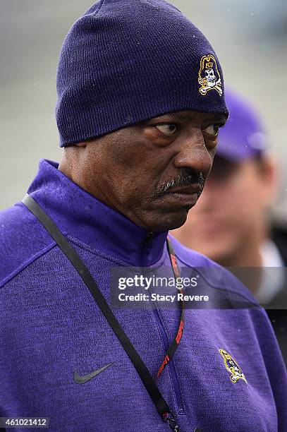 Head coach Ruffin McNeill of the East Carolina Pirates leaves the field following warmups prior to a game against the Florida Gators in the...