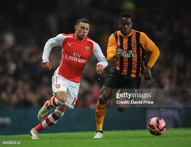 Alex Oxlade-Chamberlain of Arsenal takes on Maynor Figueroa of Hull City during the match between Arsenal and Hull City in the FA Cup 3rd Round at...