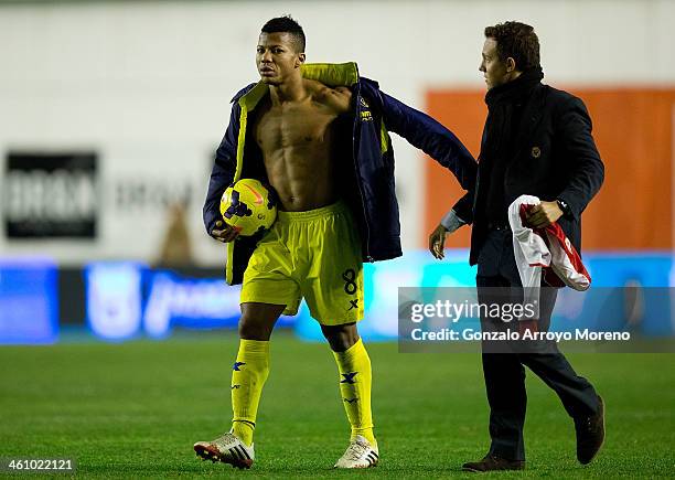 Ikechukwu Uche of Villarreal CF leaves the pitch with the ball after his hat trick during the La Liga match between Rayo Vallecano de Madrid and...