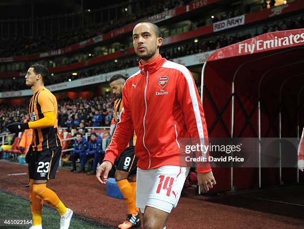 Theo Walcott of Arsenal walks out before the match between Arsenal and Hull City in the FA Cup 3rd Round at Emirates Stadium on January 4, 2015 in...