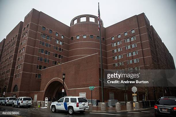 Law enforcement officials stand guard outside the John Joseph Moakley United States Courthouse January 4, 2015 in Boston, Massachusetts. Jury duty is...