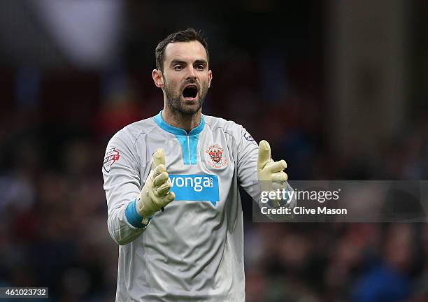 Joe Lewis of Blackpool gesticulates during the FA Cup Third Round Match between Aston Villa and Blackpool at Villa Park on January 4, 2015 in...