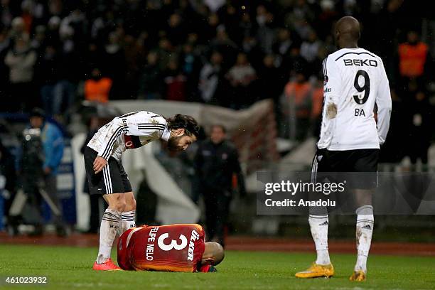 Felipe Melo of Galatasaray lays on the ground during a fight with Olcay Sahan of Besiktas during the Turkish Spor Toto Super League soccer match...