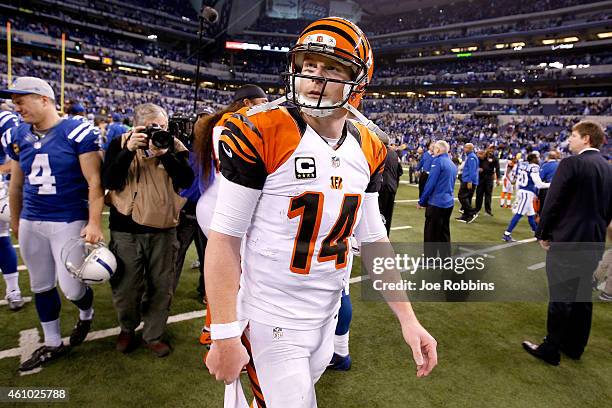 Andy Dalton of the Cincinnati Bengals leaves the field after the Bengals loss to the Indianapolis Colts during their AFC Wild Card game at Lucas Oil...