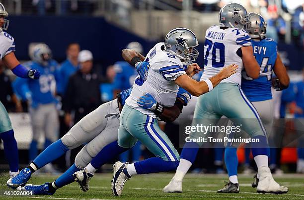 Tony Romo of the Dallas Cowboys is sacked by Ezekiel Ansah of the Detroit Lions during the first half of their NFC Wild Card Playoff game at AT&T...