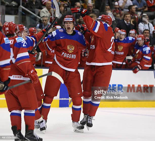 Russia celebrates the 2nd goal. 2015 IIHF World Junior Championship hockey, 2nd period Semi Final action between Russia and Sweden at the Air Canada...