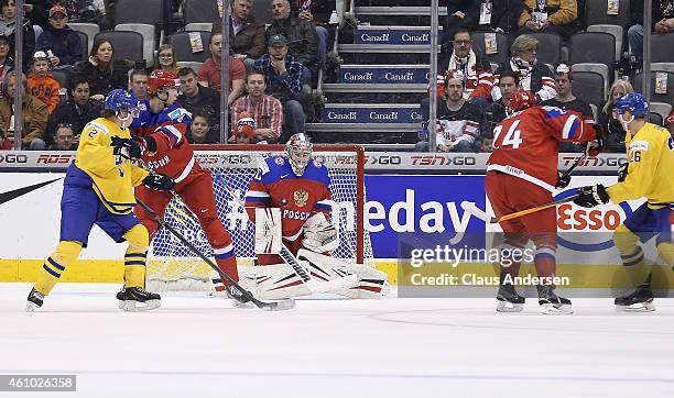 Igor Shesteryorkin of Team Russia makes a stop against of Team Sweden during a semi-final game in the IIHF World Junior Hockey Championship at the...