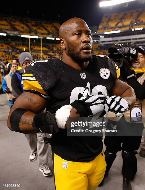 James Harrison of the Pittsburgh Steelers walks off the field after the game against the Cincinnati Bengals at Heinz Field on December 28, 2014 in...