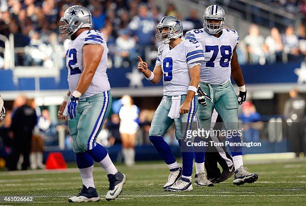 Tony Romo of the Dallas Cowboys reacts against the Detroit Lions as Travis Frederick of the Dallas Cowboys and Jermey Parnell of the Dallas Cowboys...