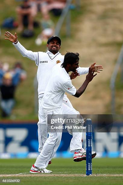 Nuwan Pradeep of Sri Lanka celebrates his wicket of Tom Latham of New Zealand during day three of the Second Test match between New Zealand and Sri...