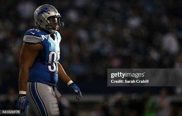 Ndamukong Suh of the Detroit Lions walks towards the sideline after a possession against the Dallas Cowboys during the first half of their NFC Wild...